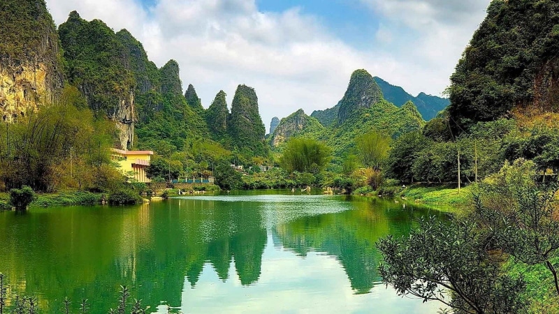 travel destinations, trees, beauty in nature, China, forest, tranquility, tranquil scene, architecture, mountain, green color, cliff, nature, lake, shrubs