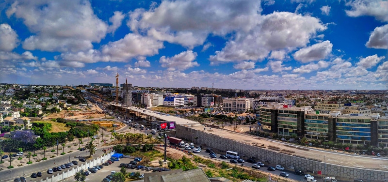 car, road, city, transportation, mode of transportation, morocco, outdoors, travel destinations, architecture, modern, nature, building exterior, cityscape