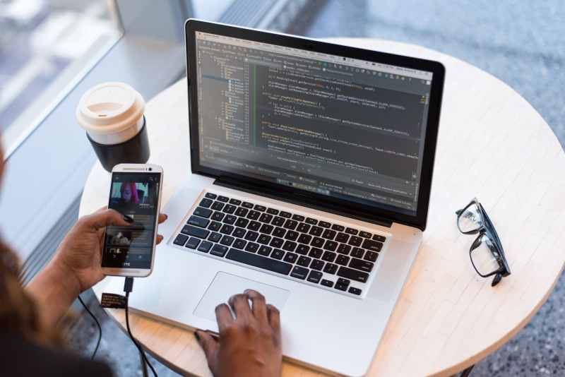 desk, glasses, developer, place of work, coffee cup, people, coffee, adult, using laptop, one person, connection, portable information device, cup, laptop