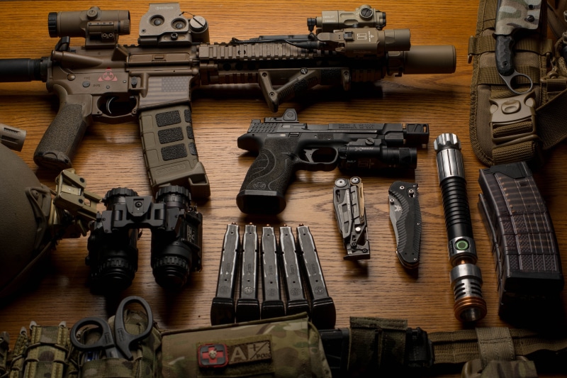 social issues, bullet, knife, table, large group of objects, high angle view, group of objects, assault rifle, arrangement, 5K, no people, binoculars