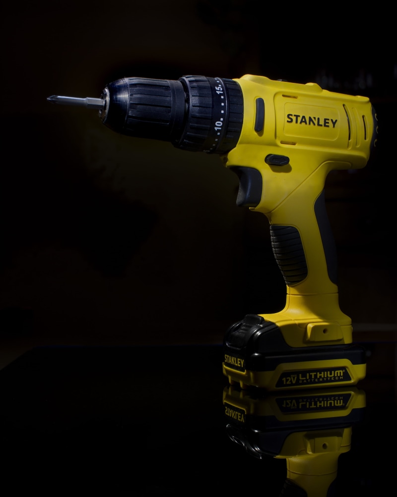 black color, blender, cordless, table, machine, studio shot, western script, flashlight, toy, screwdriver, cowbell, single object, communication, lamp