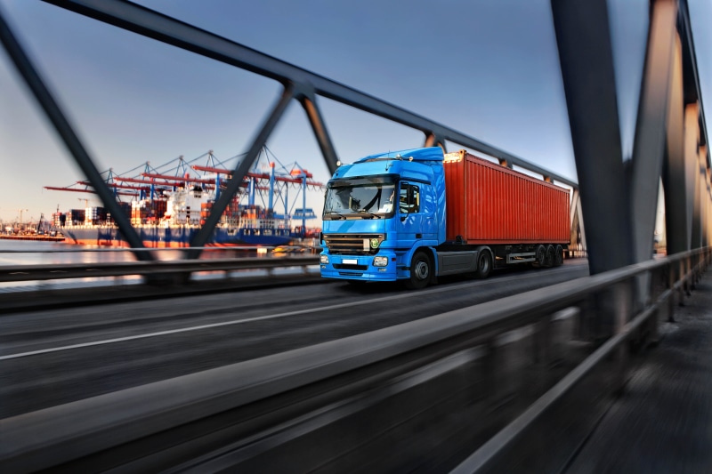 blue, freight transportation, industry, motion, blurred motion, land vehicle, container, tractor, road, port, car, blur, mode of transportation