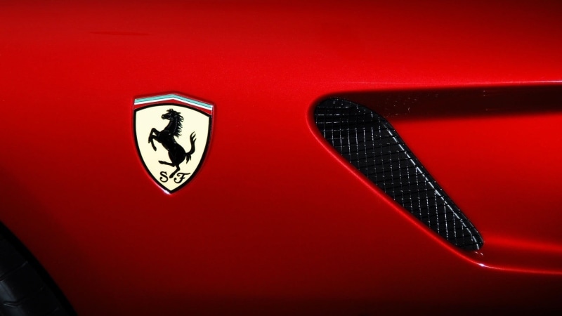 studio shot, Ferrari, social issues, high angle view, red cars, vehicle, logo, red, car, no people, single object, colored background, communication, symbol