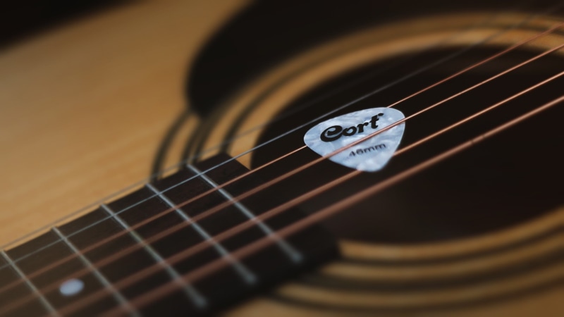 acoustic guitar, music, indoors, no people, photography, studio shot, brown, wind instrument, single object, acoustic, Cort Guitars, focus on foreground