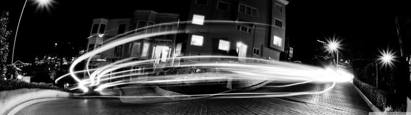 street, road, timelapse, building exterior, light trail, illuminated, no people, light trails, motion, photography, dark, monochrome, wheel, blurred motion