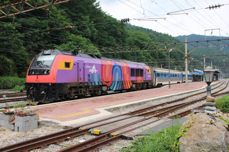5K, bus, coach, passenger, power line, train, tree, outdoors, transportation, travel, day, rail transportation, diesel, plant, platform, sky, cable, korea