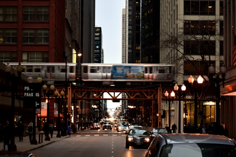 building exterior, city life, architecture, railway, the loop, car, outdoors, land vehicle, city, road, building, bridge, mode of transportation, bridge - man made structure