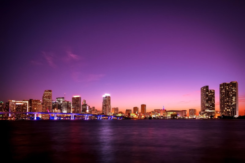 financial district, portrait, city, outdoors, purple, Florida, building, lighted, Miami, night, built structure, waterfront, modern, skyscraper, architecture