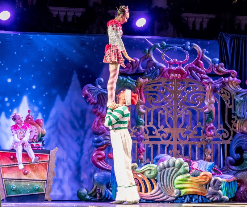 orlando, christmas show, gaylord palms, arms raised, female likeness, Acrobats, religion, Cirque Du Soleil, multi colored, candy cane, spirituality, woman
