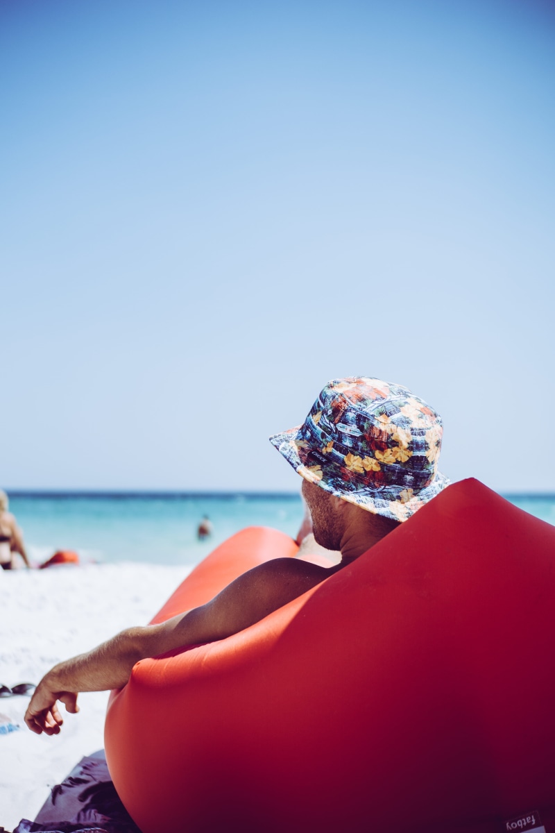 one Person, sand, blue, ocean, lying, sky, adult, red, outdoors, sunglasses, sunlounger, beauty, person, women, young Adult, hat, enjoyment, pensacolabeach