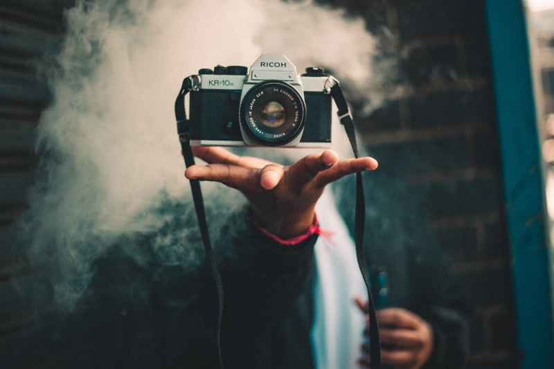 slr camera, photographing, activity, 5K, lifestyles, levitation, hand, trick, equipment, vape, silver, dslr, adult, occupation, person, digital camera