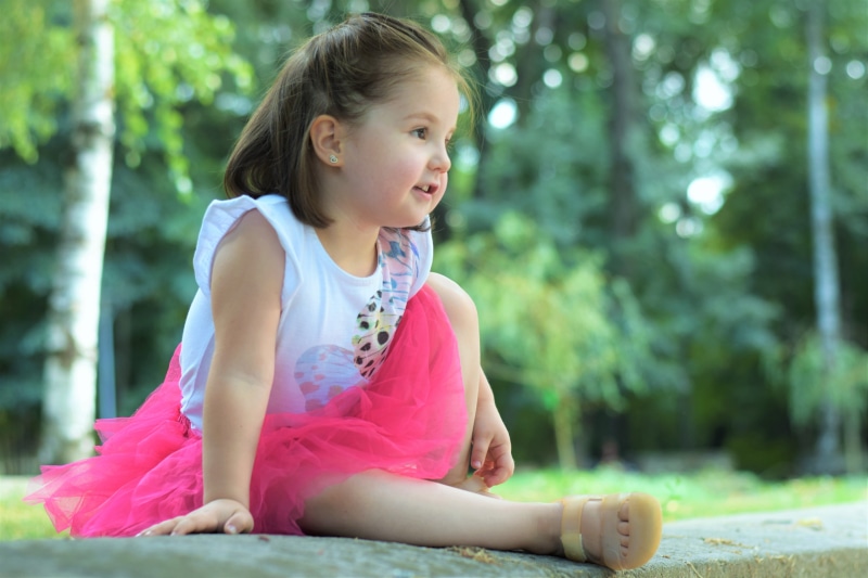 Girl, Cute, portrait, hairstyle, sitting, focus on foreground, children only, gutter, looking, person, contemplation, little, day, Child, one person, looking away