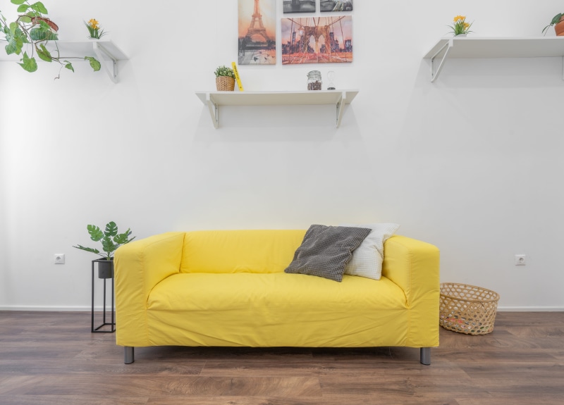 armchair, pillow, flooring, corner, wall, home showcase interior, cozy, comfortable, sofa, 5K, floor, modern, chair, waiting room, room, seat, bedroom