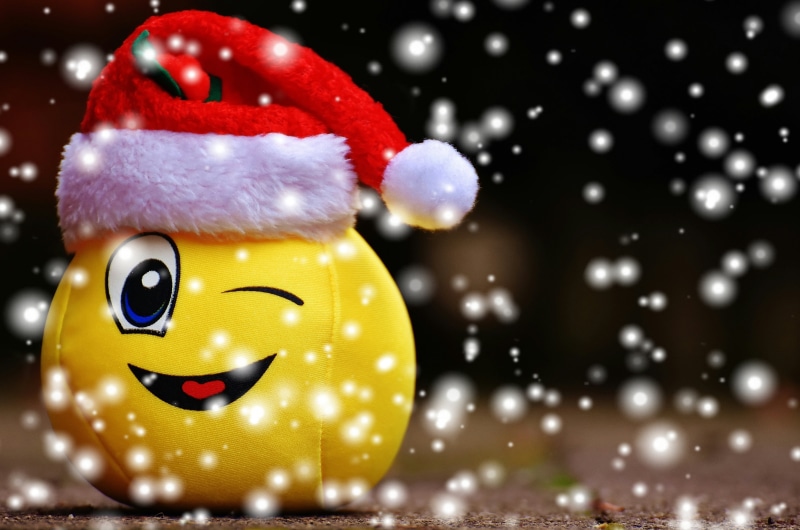 smiling, yellow, no people, snow, red, smiley, santa, snowing, focus on foreground, single object, holiday, close-up, cheerful, christmas, hat, night, plush