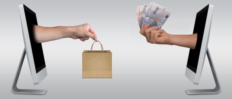 exchanging, adult, computer, human body part, digital, indoors, euro, human hand, selling, consumerism, men, males, currency, sales, wealth, bag, e-commerce