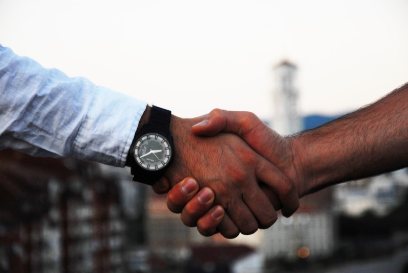 close, success, building, watch, focus on foreground, adult, deal, business, communication, hand, caucasian, woman, people, diplomacy, corporate, human body part