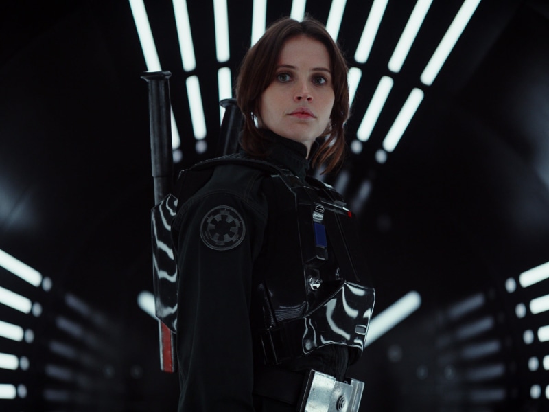 Imperial outfit, movies, architecture, brunette, waist up, actress, s, portrait, holding, red lipstick, focus on foreground, costume, Rogue One: A Star Wars Story
