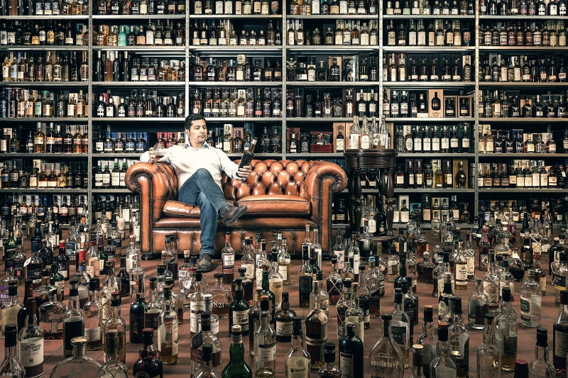 whiskey, standing, bottle, mid adult, indoors, education, book, 1080P, library, full length, abundance, one person, two, shelf, men, framed, adult, chairs