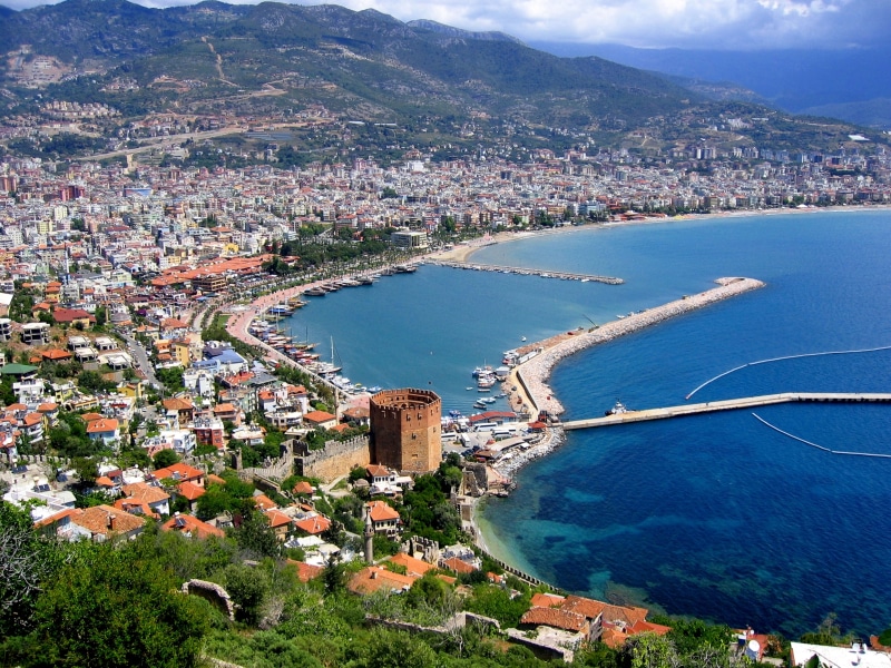 residential district, cityscape, castle, coast, 8K, turkey, built structure, rock, harbor, port, land, transportation, nature, architecture, boat, high angle view