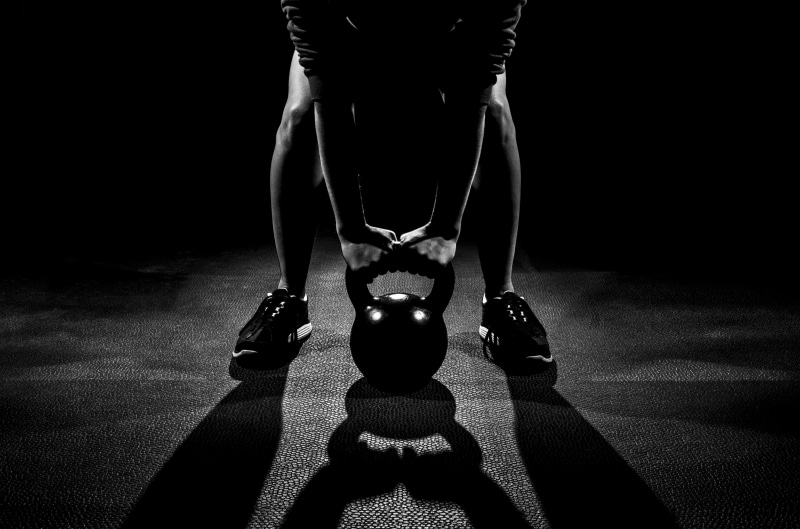 strength, slim, caucasian Ethnicity, real people, bell, action, people, black background, body part, dark, one Person, beauty, lifestyles, the Human Body