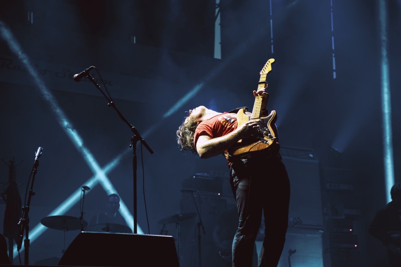 playing, stage - Performance Space, musical Band, guitarist, skill, wearing, sound, entertainment Event, stage, indoors, electric Guitar, performing Arts Event