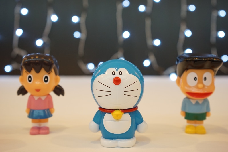 doll, manga, snow, doraemon, creativity, toy, human representation, toys, figurine, no people, 5K, close-up, clothing, cat for android, anime, focus on foreground