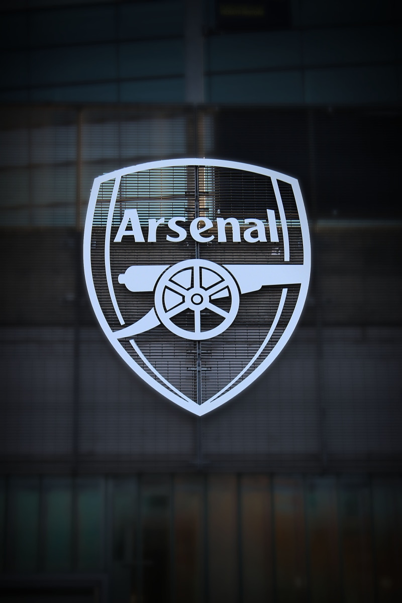focus on foreground, information, reflection, Arsenal, logo, glass - material, london, no people, england, photo, western script, communication, symbol