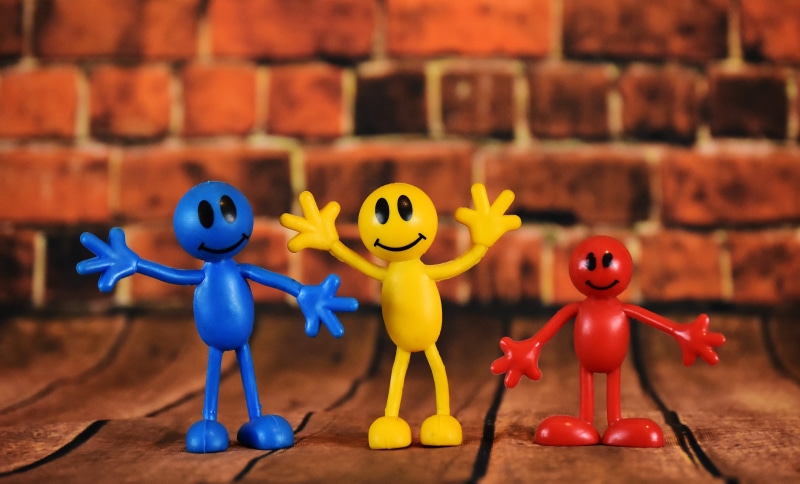 brick, childhood, males, figures, cute, day, three, yellow, plastic, focus on foreground, close-up, representation, red, smiley, toys, group of objects