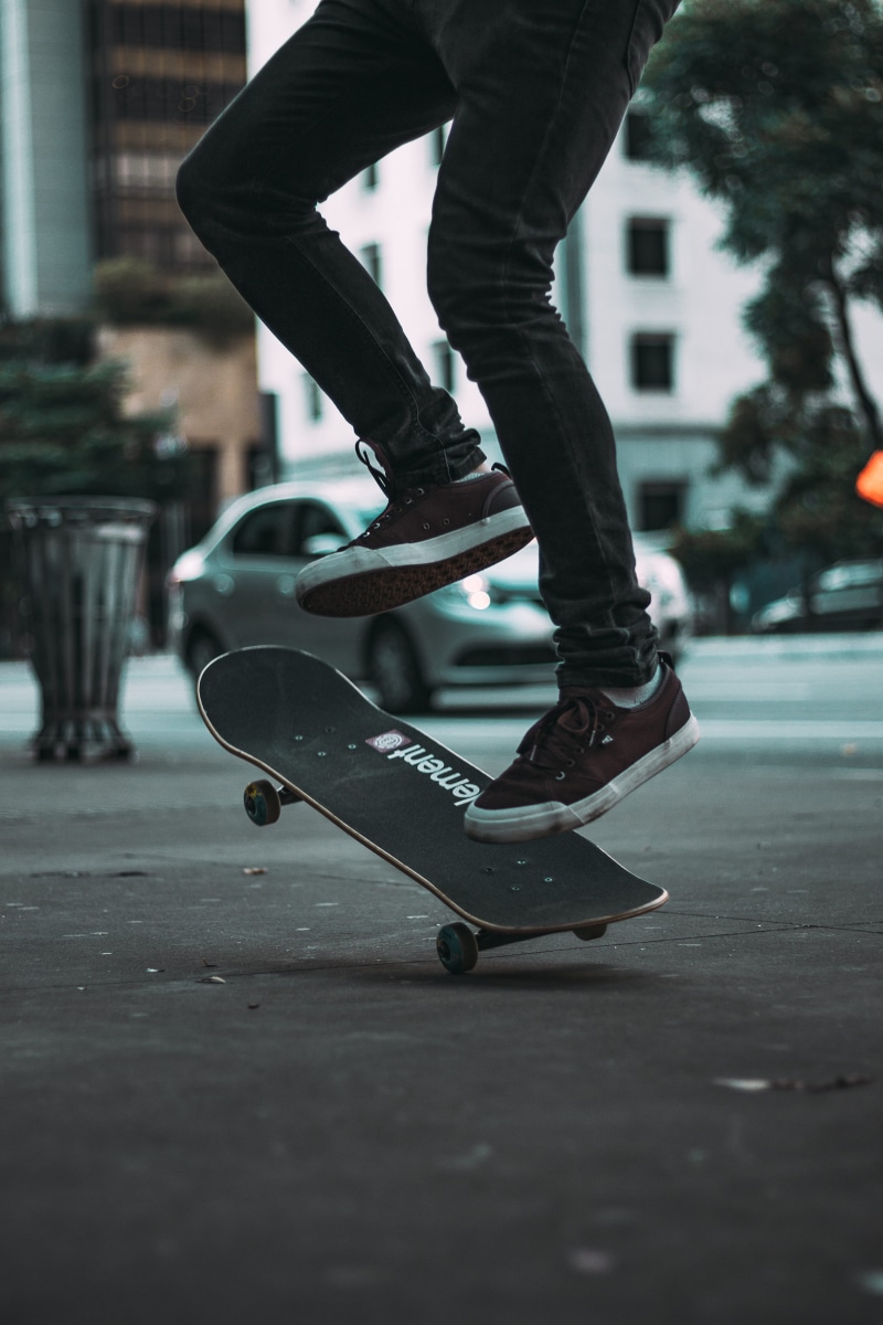real people, skating, person, fun, kickflipping, skateboard, low section, shoe, action, lifestyles, active, outdoors, sport, balance, men, architecture