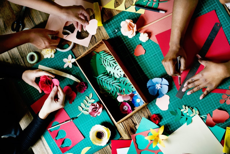 creativity, food and drink, adult, high angle view, working, celebration, finger, flowers, leisure games, indoors, women, crafts, human body part, human Hand