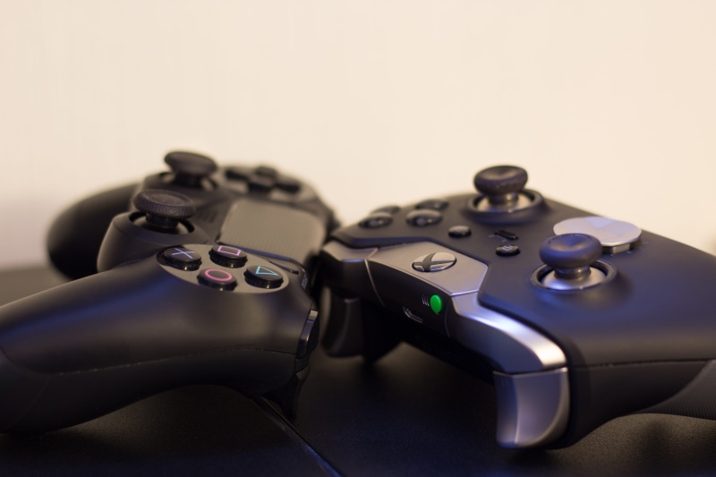 table, two objects, robot, indoors, military, weapon, controller, technology, consoles, studio shot, xbox, close-up, 5K, control, black color, handgun