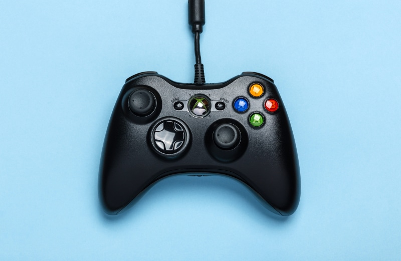 colored background, black color, equipment, directly above, single object, metal, technology, no people, microsoft, electronics, black, blue background