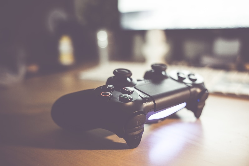 video game console, no people, focus on foreground, table, control, technology, sony, musical instrument, controller, aggression, photography themes, close-up