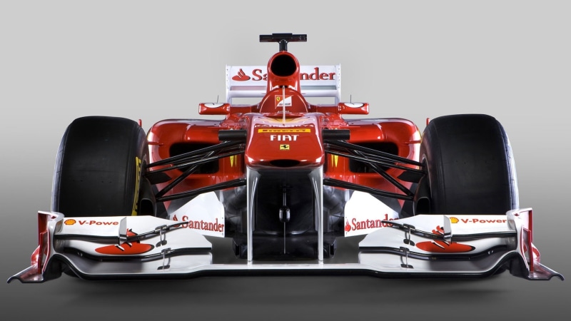 front view, car, people, sport, indoors, studio shot, white, control, power, technology, wheel, vehicle, race cars, sign, mode of transportation, number