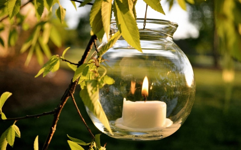 close-up, nature, white, bank, holder, lighting equipment, tranquil Scene, glass, focus on foreground, outdoors, transparent, yellow, leaf, candlelight