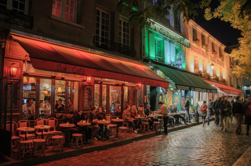 evening, awning, people, built structure, city life, street market, bar - Drink Establishment, street, women, france, architecture, large group of people