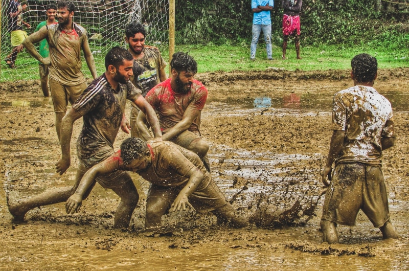 monsoon, real people, dirt, kerala, mud football, occupation, mud, water, field, group of people, outdoors, day, farmer, lifestyles, dirty, men, people