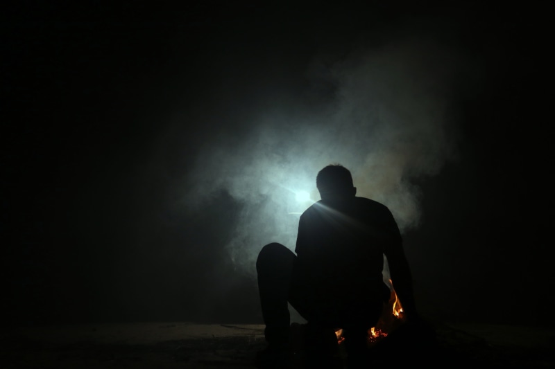 apocalypse, real people, fire, ruins, lifestyles, night, full length, food, coal, human, smoke - physical structure, burning, leisure activity, nature