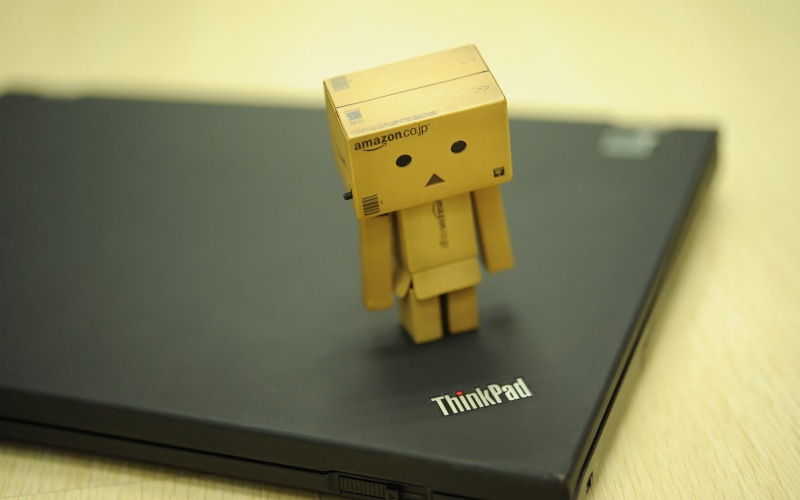 electricity, indoors, lenovo, human representation, representation, technology, thinkpad, box - Container, selective focus, carton, high angle view, table