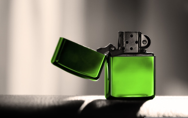 lighter, green color, photography themes, connection, communication, shadow, electric lamp, no people, table, simplicity, single object, creativity, close-up