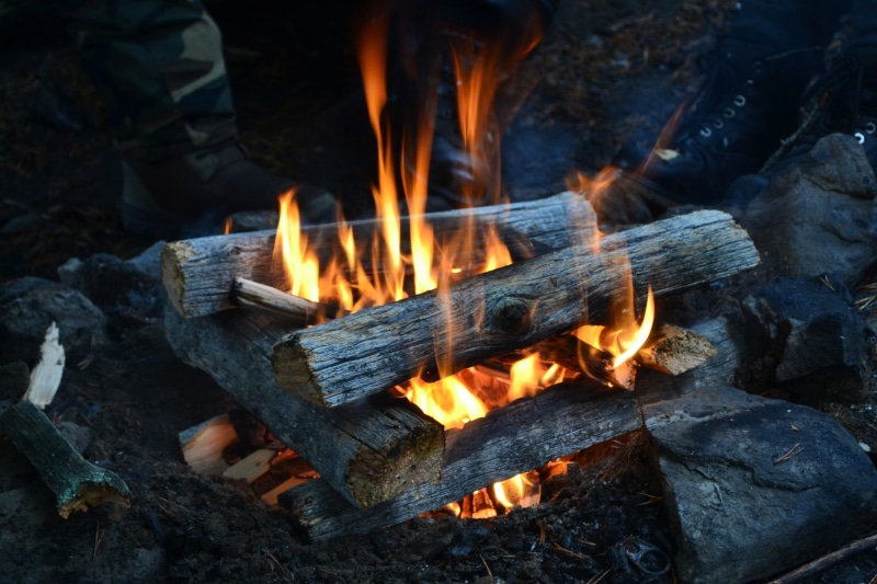 orange color, camp out, high angle view, long exposure, sanctuary, wood, heat - temperature, fire - natural phenomenon, camp fire, warm, fun, outdoors