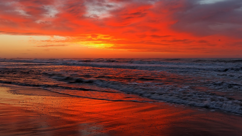 sunset, motion, calm, no people, beauty in nature, sea, orange color, dramatic sky, sky, red sky, nature, wave, coast, shore, cloud - sky, ocean, land