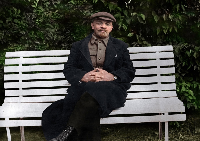 black, adult, Vladimir Ulyanov, 1080P, warm clothing, clothing, day, bench, portrait, looking at camera, sitting, coat, lifestyles, senior adult, hat