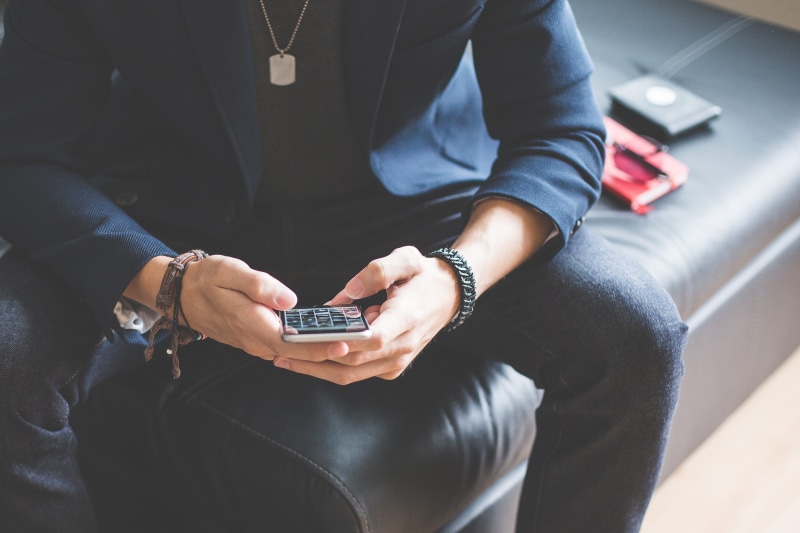 work, indoors, couch, fashion, mobile phone, human Hand, business, lifestyles, human body part, technology, hand, Sofa, wireless Technology, text Messaging