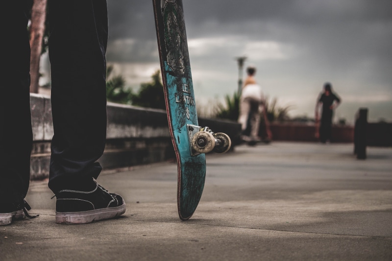 human leg, human body part, sneaker, skating, standing, overcast, trucks, dirty, day, skill, skateboard, human foot, skate park, men, wheel, nature, low section