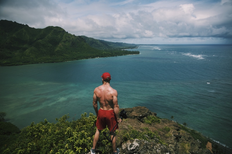 sea, travel, man, leisure activity, clouds, ocean, trip, holiday, shirtless, shorts, lifestyles, beauty in nature, surrounded, standing, scenics - nature
