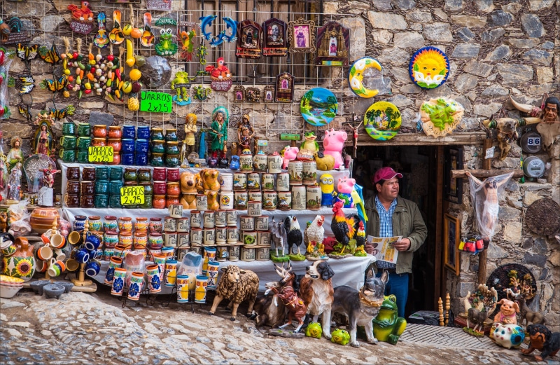 abundance, mammal, multi colored, pottery, person, real de catorce, sell, retail display, domestic animals, standing, news, retail, one person, market