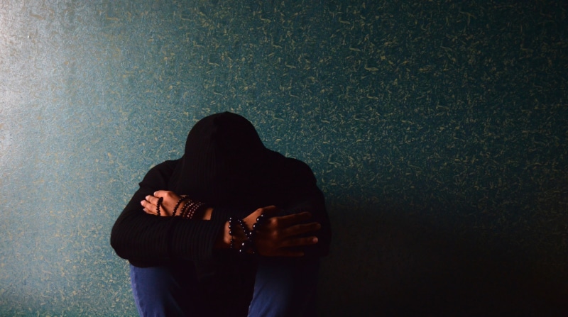 depression - sadness, unhappy, sorrow, person, lifestyles, three quarter length, male, sitting, sad, outdoors, rear view, kneeling, unrecognizable person