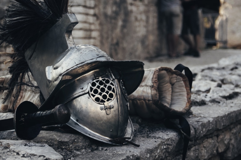 gear, single object, focus on foreground, fight, armor, steel, photo, wall, hero, ancient, outdoors, damaged, spartan, history, battle, 5K, day, man, suit of armor