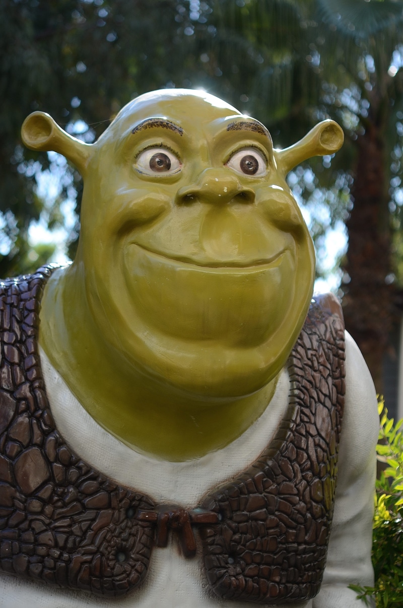 figurine, troll, gold colored, green, martian, shrek, representation, art and craft, human representation, outdoors, focus on foreground, statue, 4K, sculpture